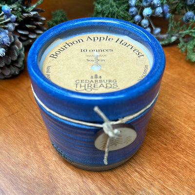 Bourbon Apple Harvest soy candle 10 ounces in blue ceramic vessel