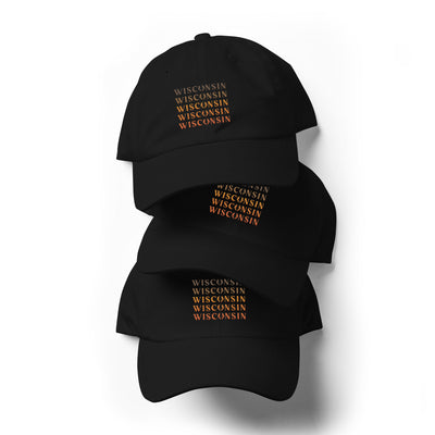 black classic dad hat with Wisconsin Buck ombre design in oranges, yellow and brown