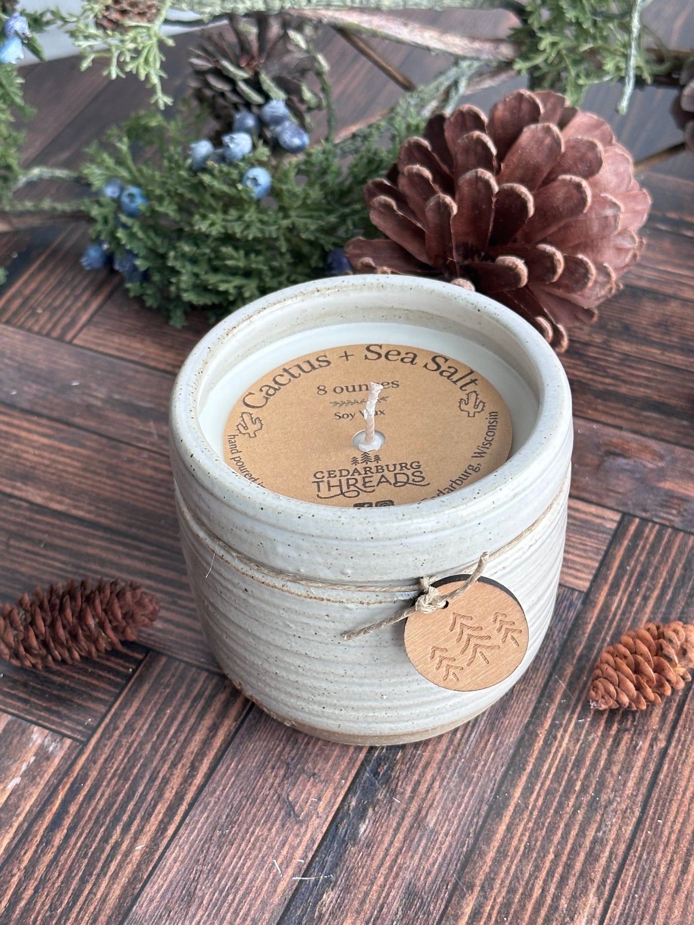 Cactus and sea salt hand poured soy candle in a handmade ceramic vessel in 8 ounces and white color