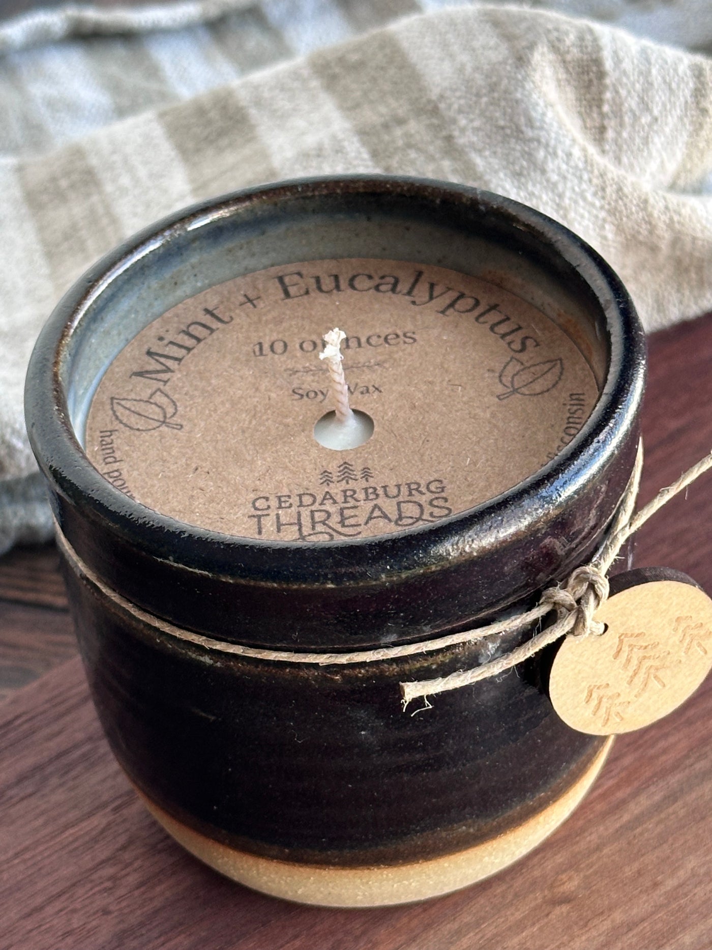 Mint & Eucalyptus soy hand poured candle in a 10 ounce dark brown vessel