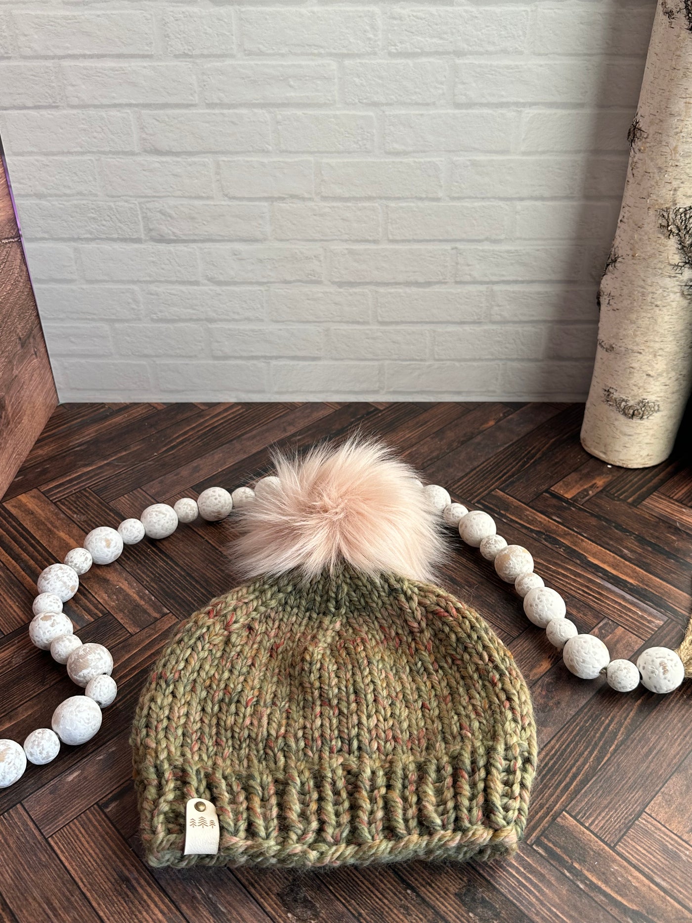 Green marble with pink faux fur pom knit beanie hat