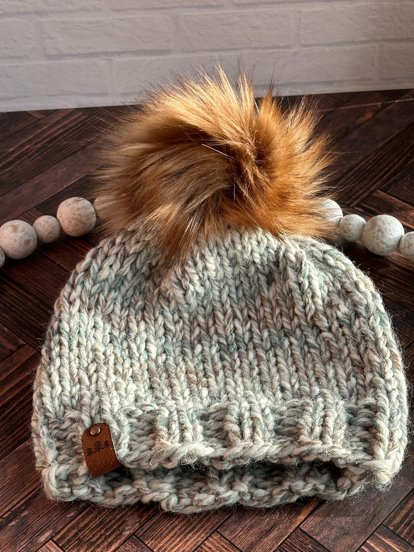 Blue marble with brown faux fur pom knit beanie hat