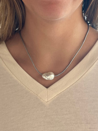 natural pearl with grey cord and lobster clasp