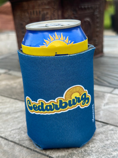 Cedarburg sun coozie in blue with yellow and brown design