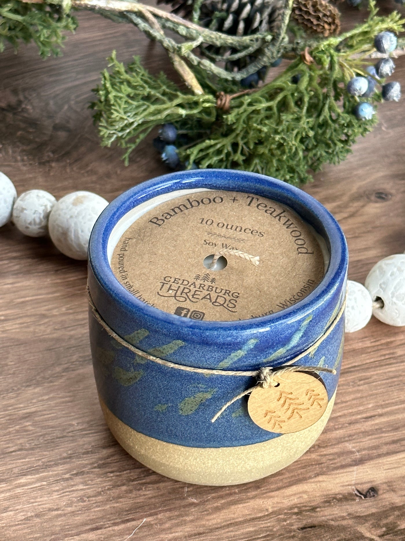 10 oz Bamboo & Teakwood soy candle in blue ceramic vessel