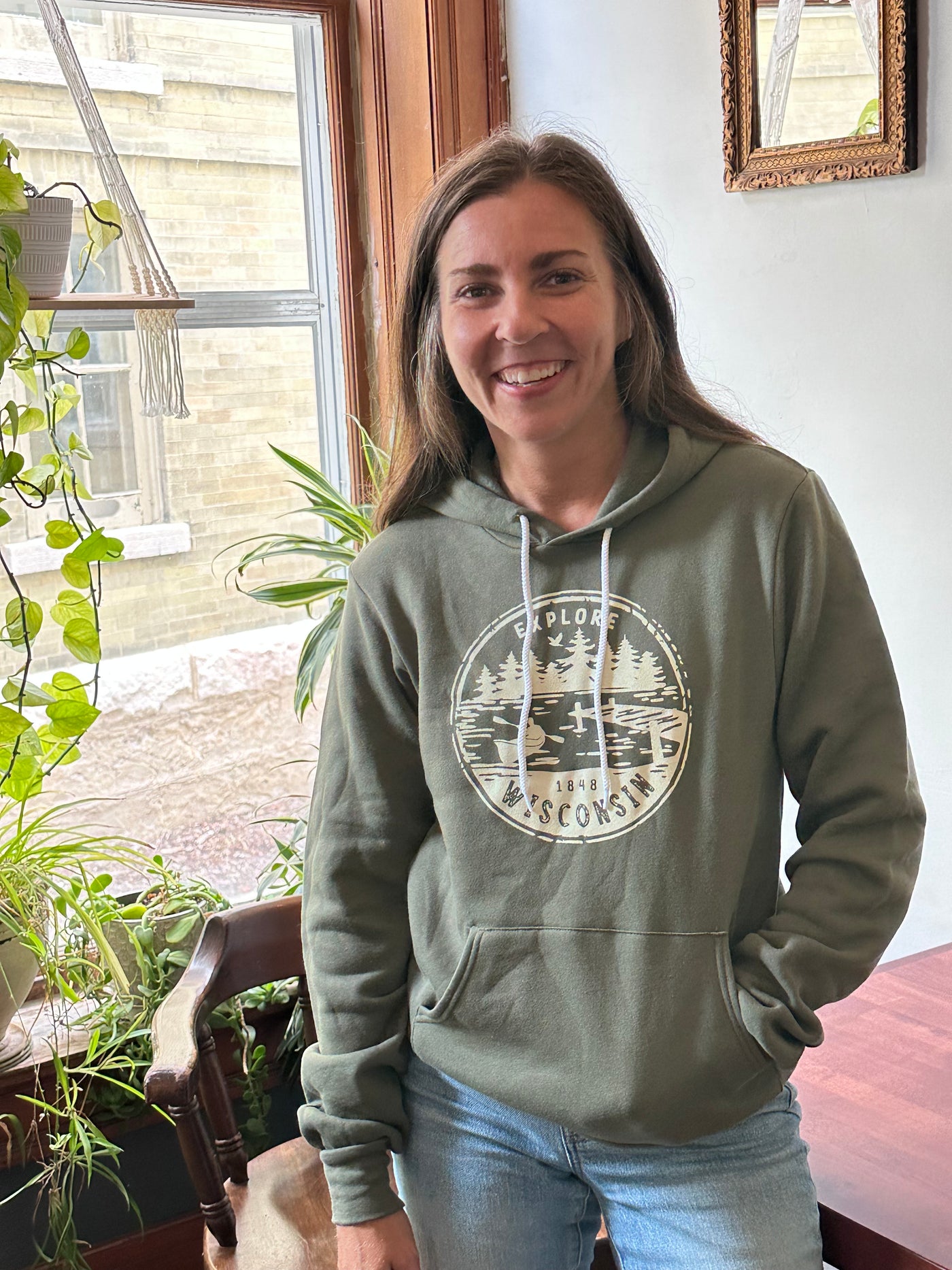 Military Green unisex hoodie with Explore Wisconsin paddle design in cream