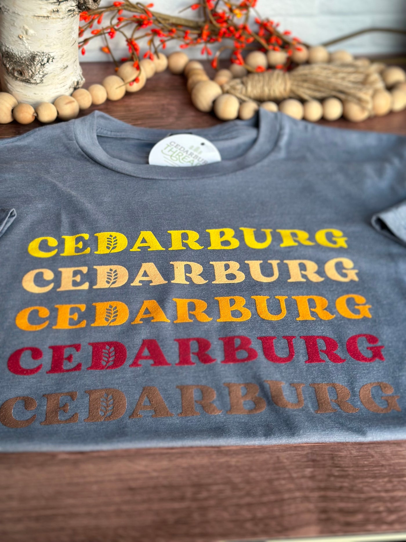 Blue triblend unisex short sleeve t-shirt with Cedarburg harvest ombre design