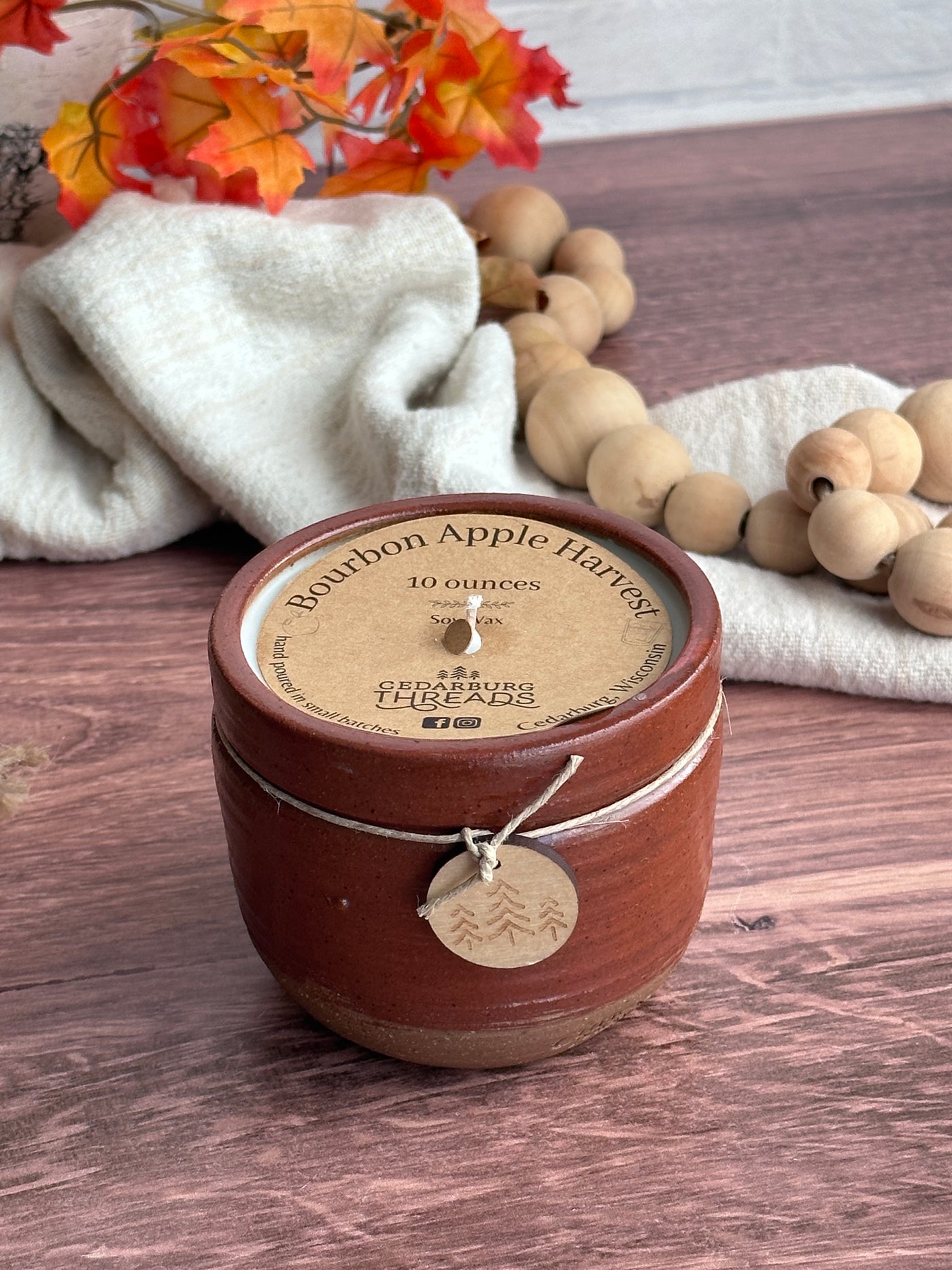 Bourbon Apple Harvest soy candle 10 ounces in brown ceramic vessel