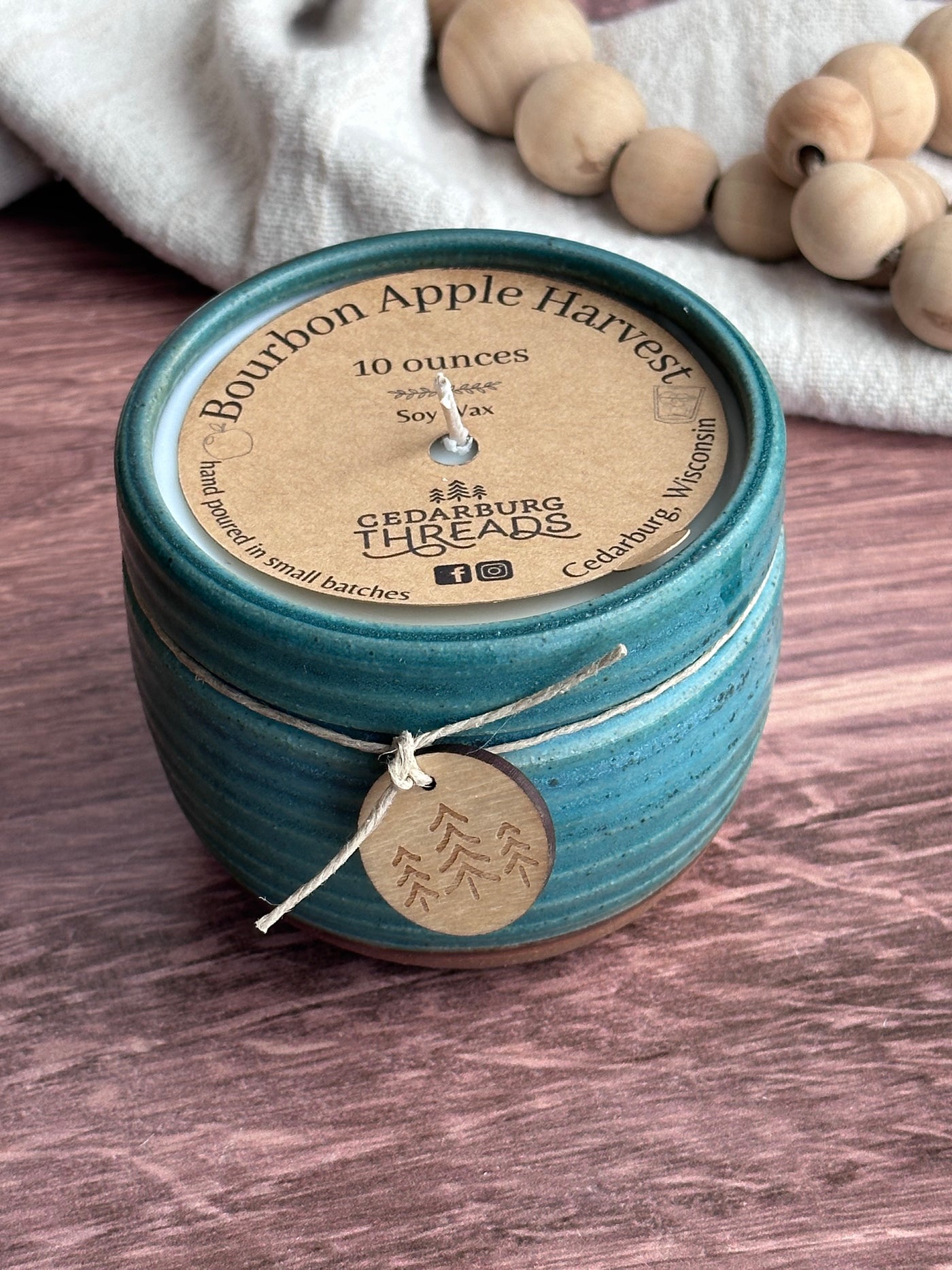 Bourbon Apple Harvest soy candle 10 ounces in teal ceramic vessel