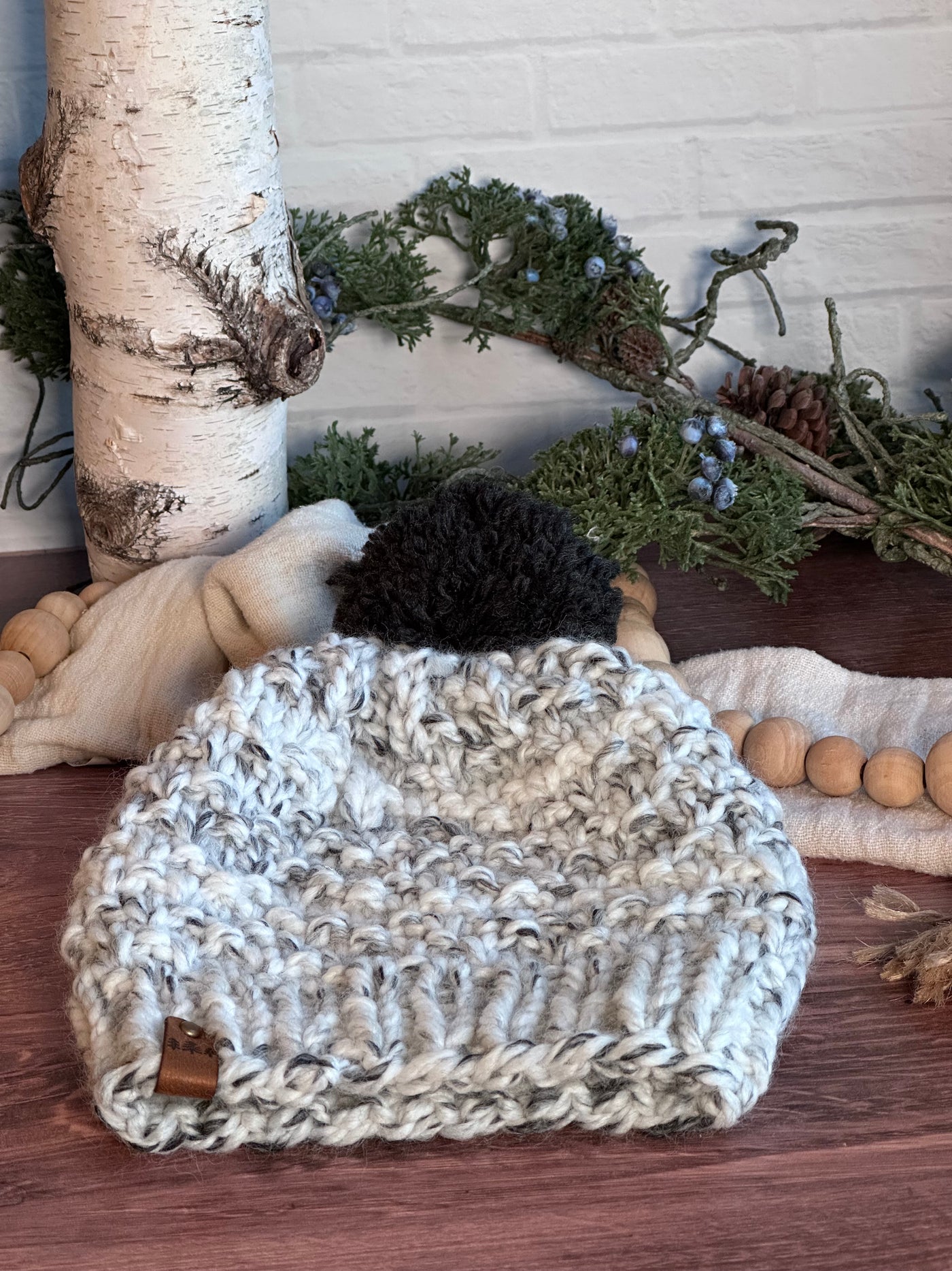 chunky knit handmade hat in grey and white with a black yarn removable Pom Pom