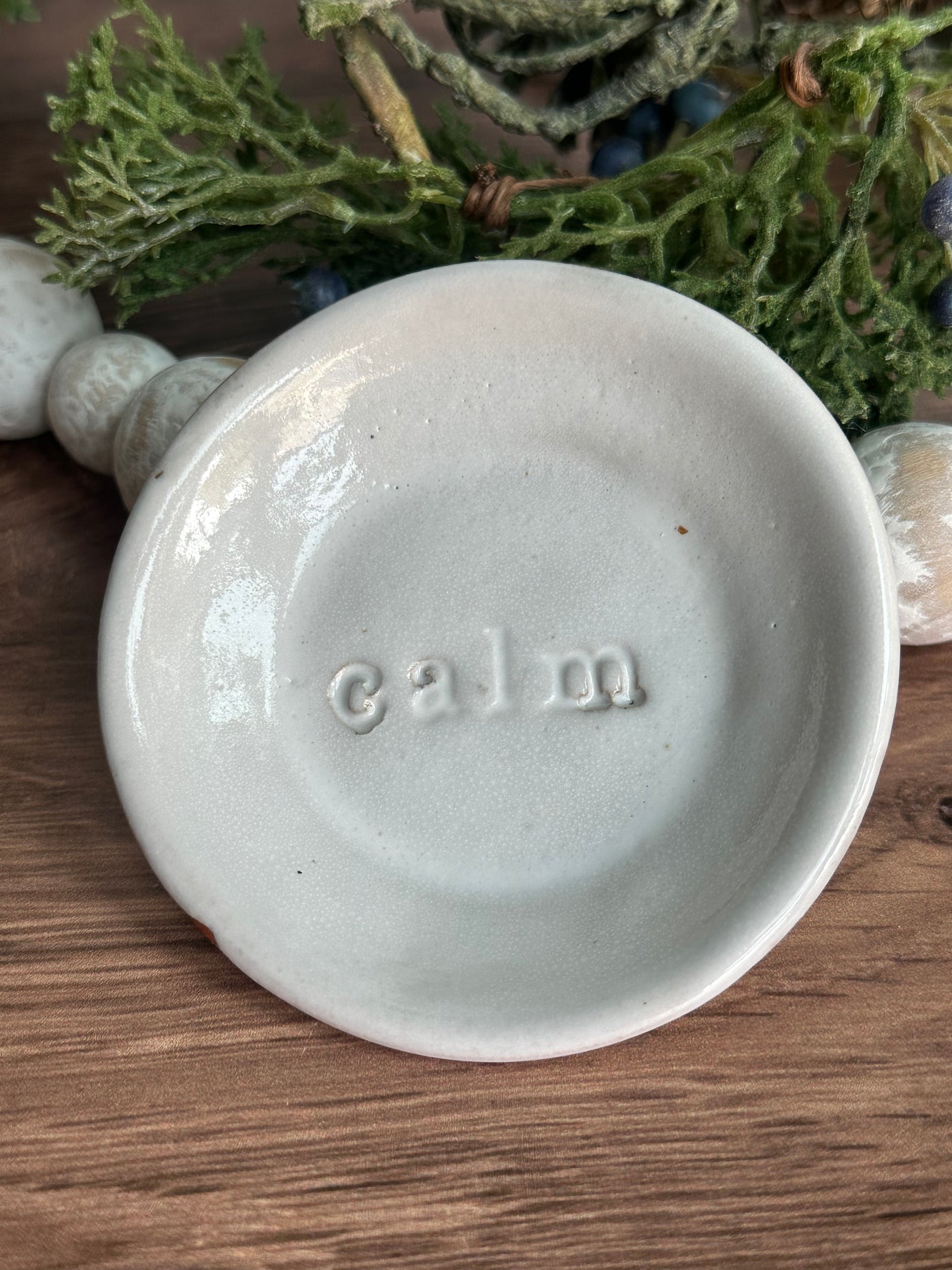 white ceramic calm wish dish