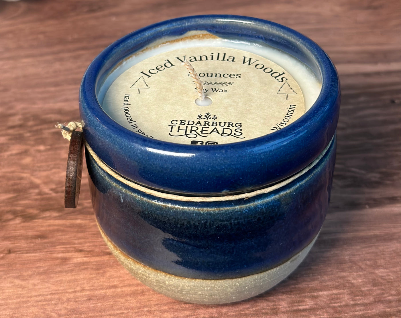 Iced Vanilla Woods hand poured soy candle  in an 8 ounce blue ceramic vessel