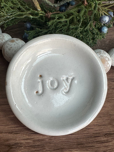 white ceramic joy wish dish