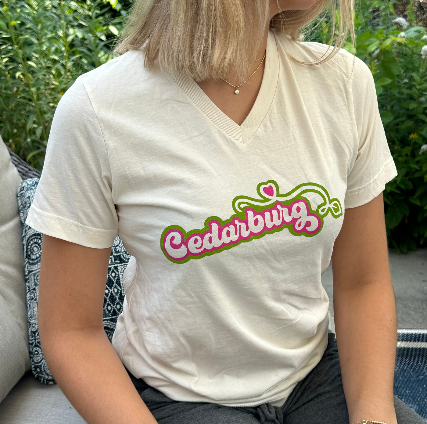 Unisex short sleeve v-neck t-shirt in natural color with Green and pink Cedarburg heart design