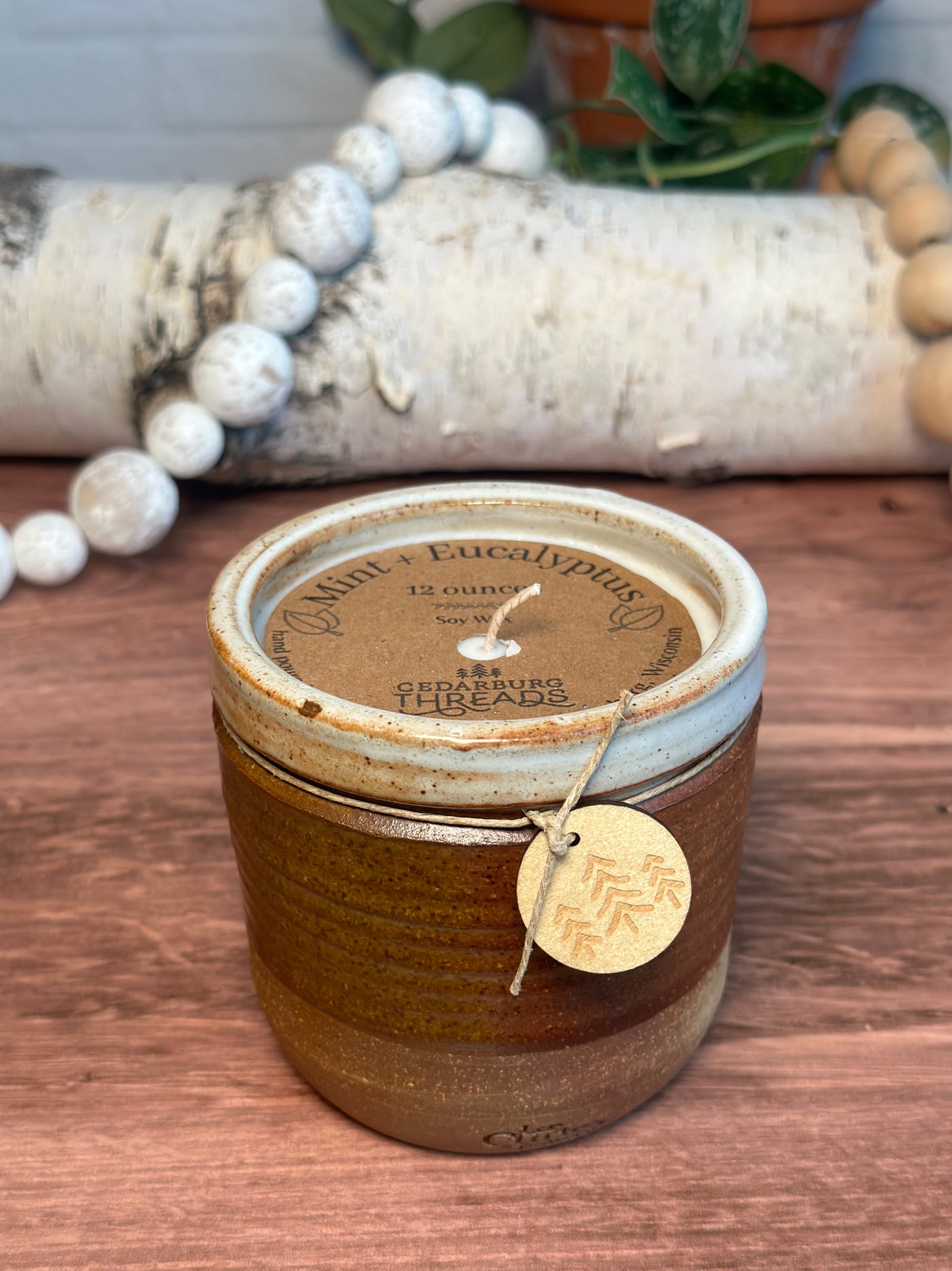 Mint & Eucalyptus soy hand poured candle in a 12 ounce brown vessel