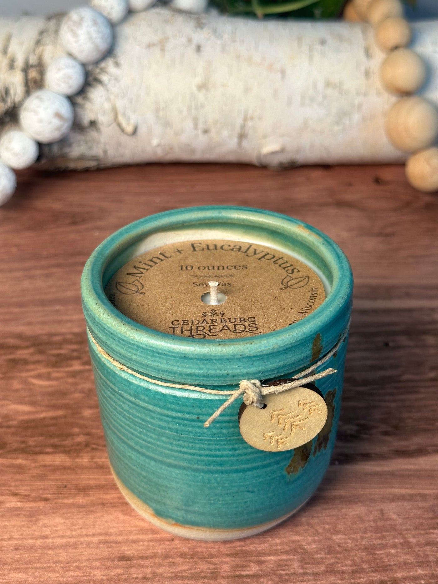 Mint & Eucalyptus soy hand poured candle in a 10 ounce teal vessel