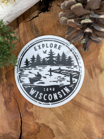 White three inch vinyl sticker with black Explore Wisconsin Paddle design 
