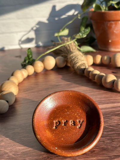 Brown ceramic pray wish dish