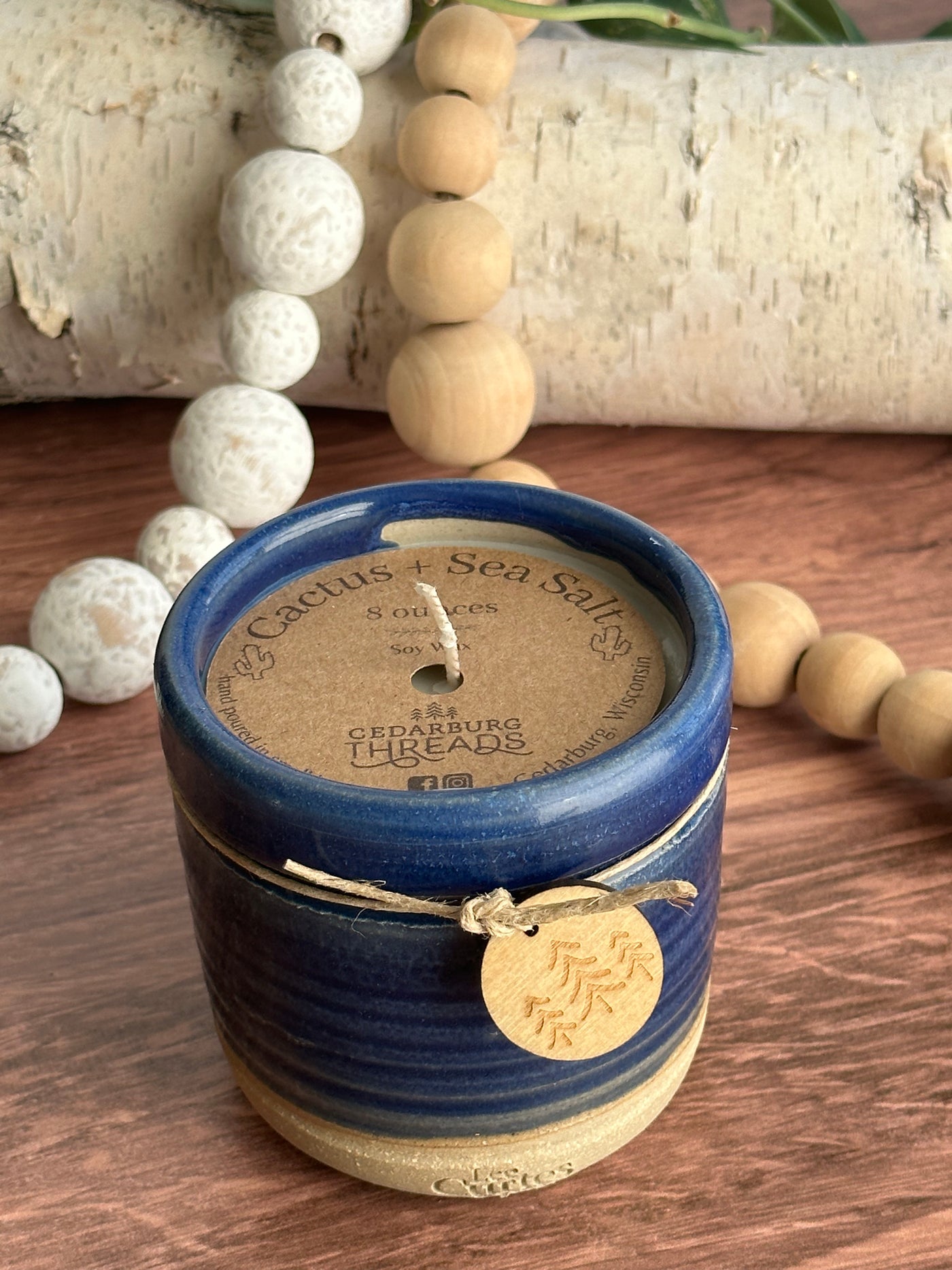 Cactus and sea salt hand poured soy candle in a handmade ceramic vessel in 8 ounces and blue  color