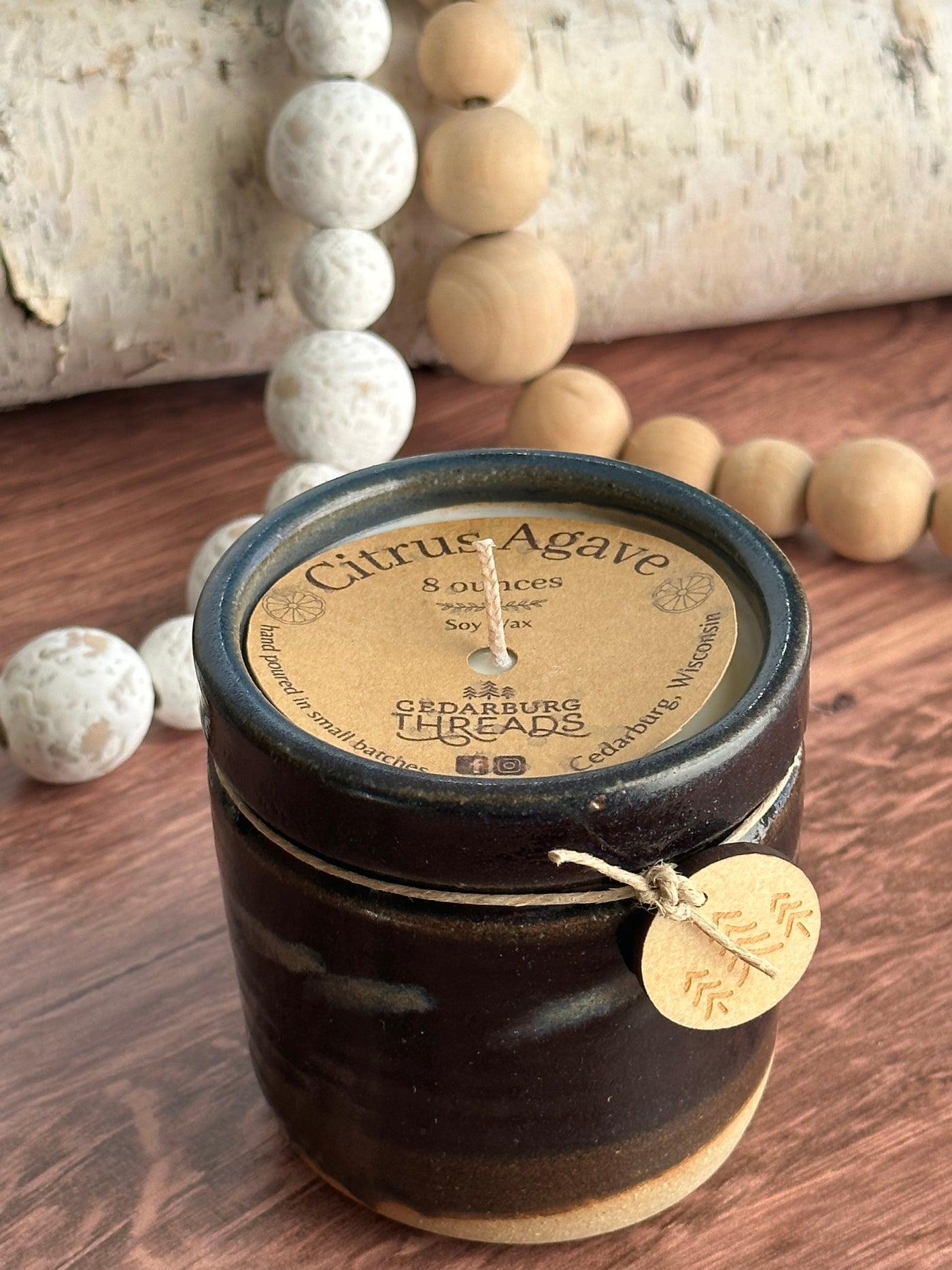 Citrus Agave hand poured soy candle in 8 ounce black ceramic candle vessel