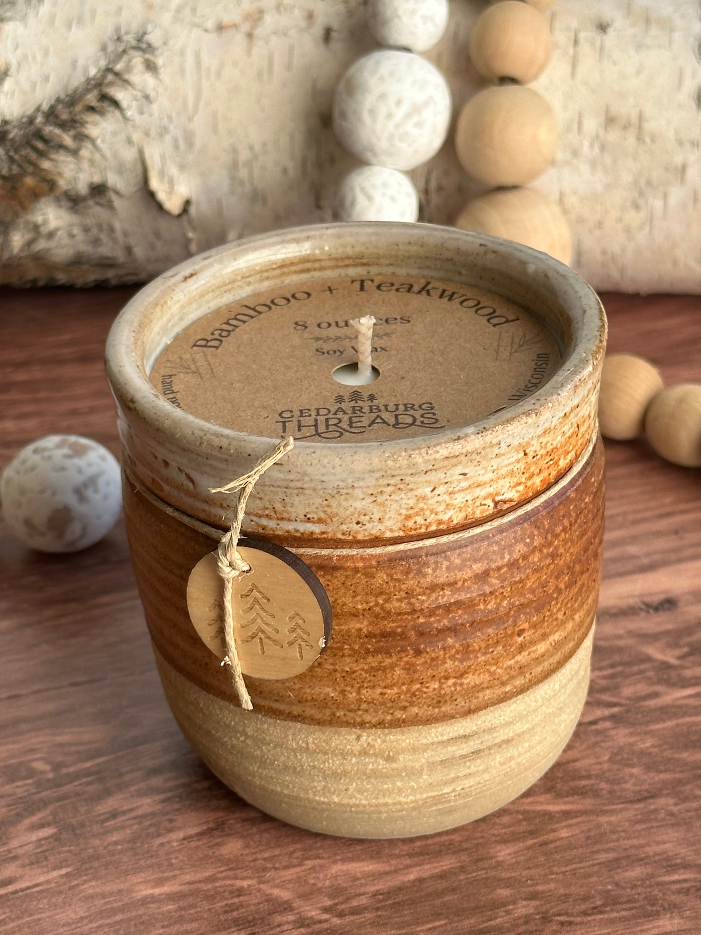 8 oz Bamboo & Teakwood soy candle in brown ceramic vessel