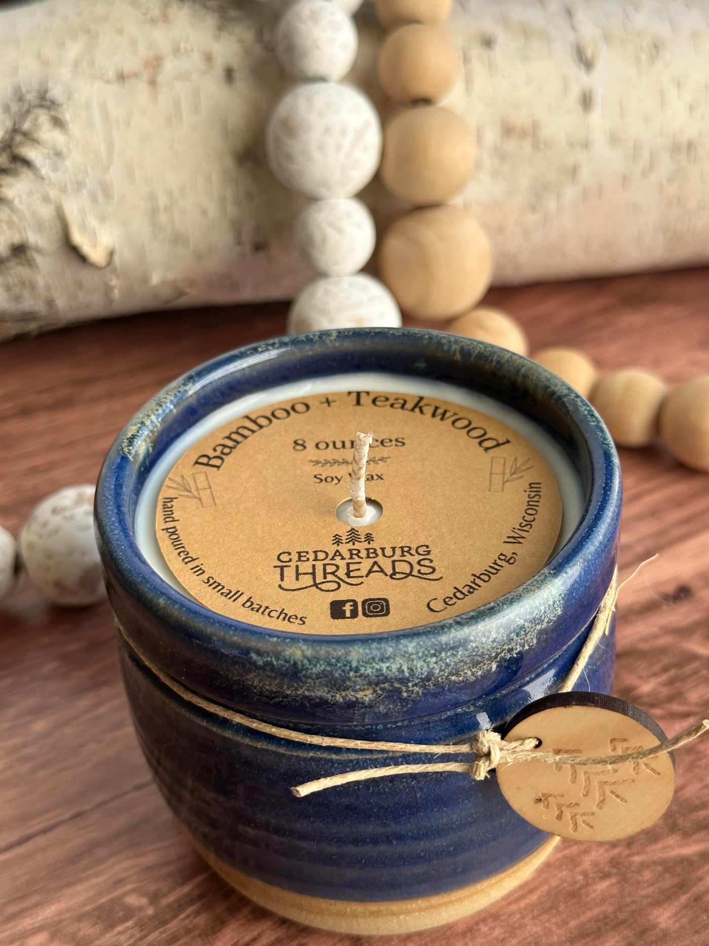 8 oz Bamboo & Teakwood soy candle in blue ceramic vessel