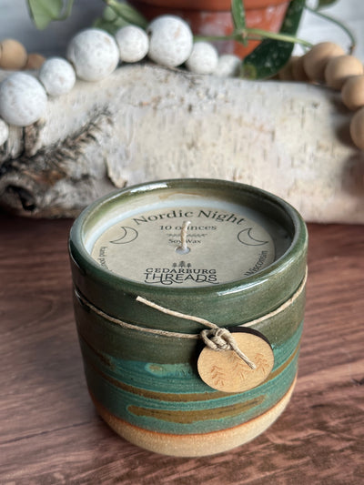 Nordic Night hand poured soy candle in handmade 10 ounce teal ceramic vessel