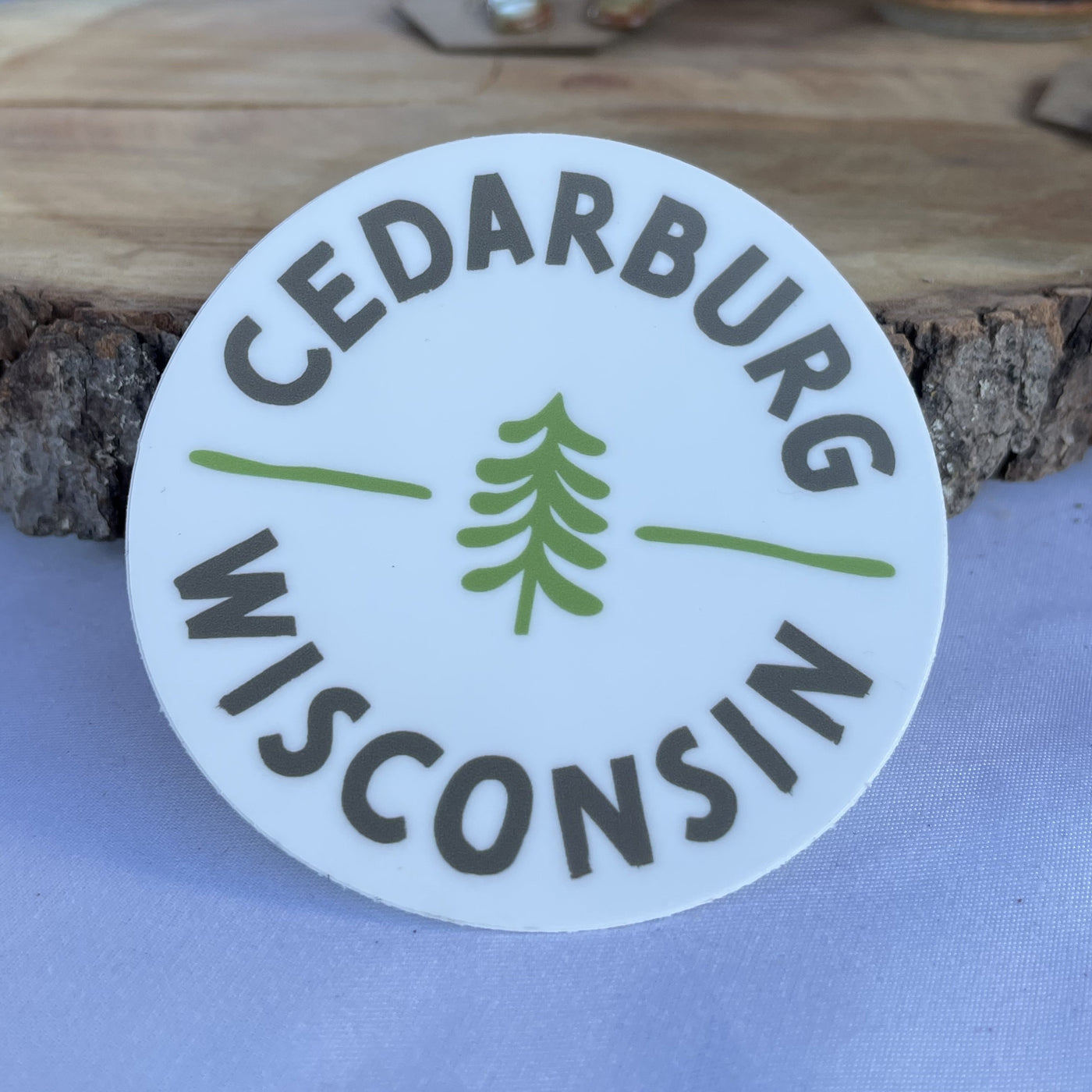 White vinyl Circle Cedarburg sticker with two color print in grey and green