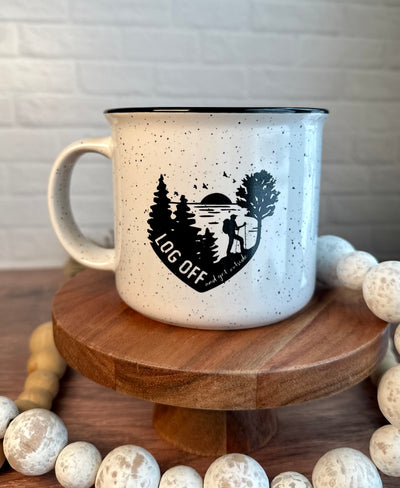 15 ounce ceramic camp style mug in white with black flecks and Log Off design in black