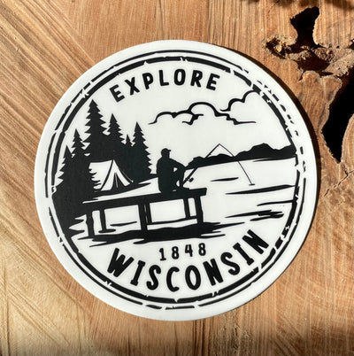 Explore Wisconsin Keeper sticker on white background with black printing of fisherman on a pier in front of a tent