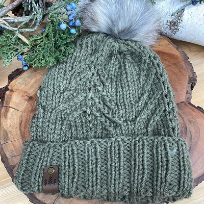 sage handmade knit hat in evergreen design and grey faux fur Pom Pom